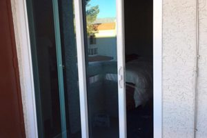 glass sliding door at porch entry replacing older door