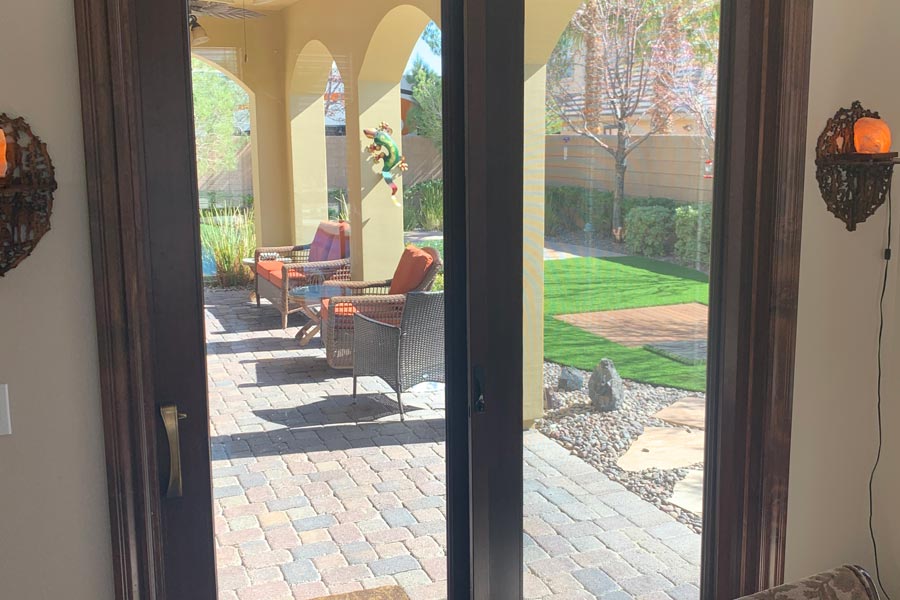 vinyl framed sliding door from house to backyard