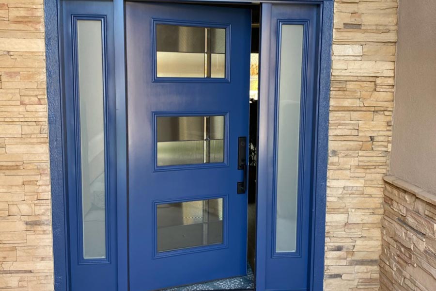 blue front door with three glass panels and sidelights