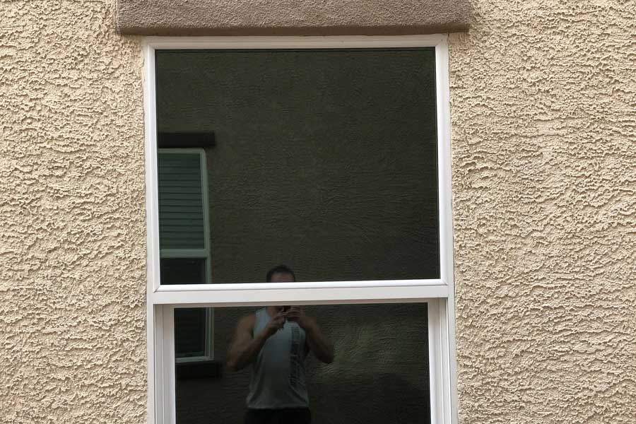 single hung window in stucco house