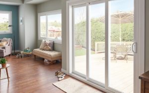 Professionally installed french sliding doors leading to a backyard
